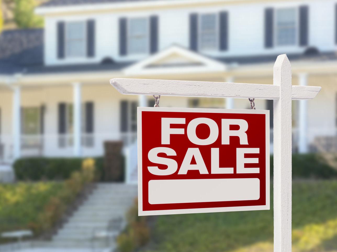 Sale sign in yard